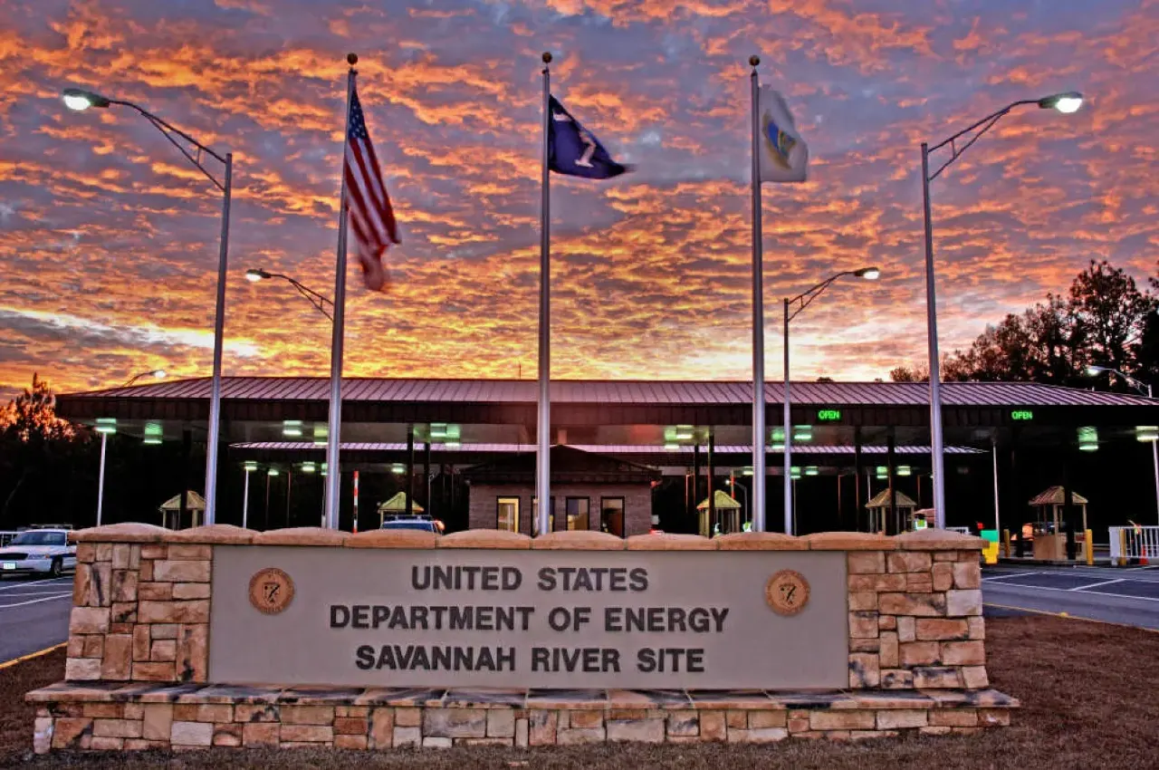 Entrance sign for the United States Department of Energy Savannah River Site at sunset.