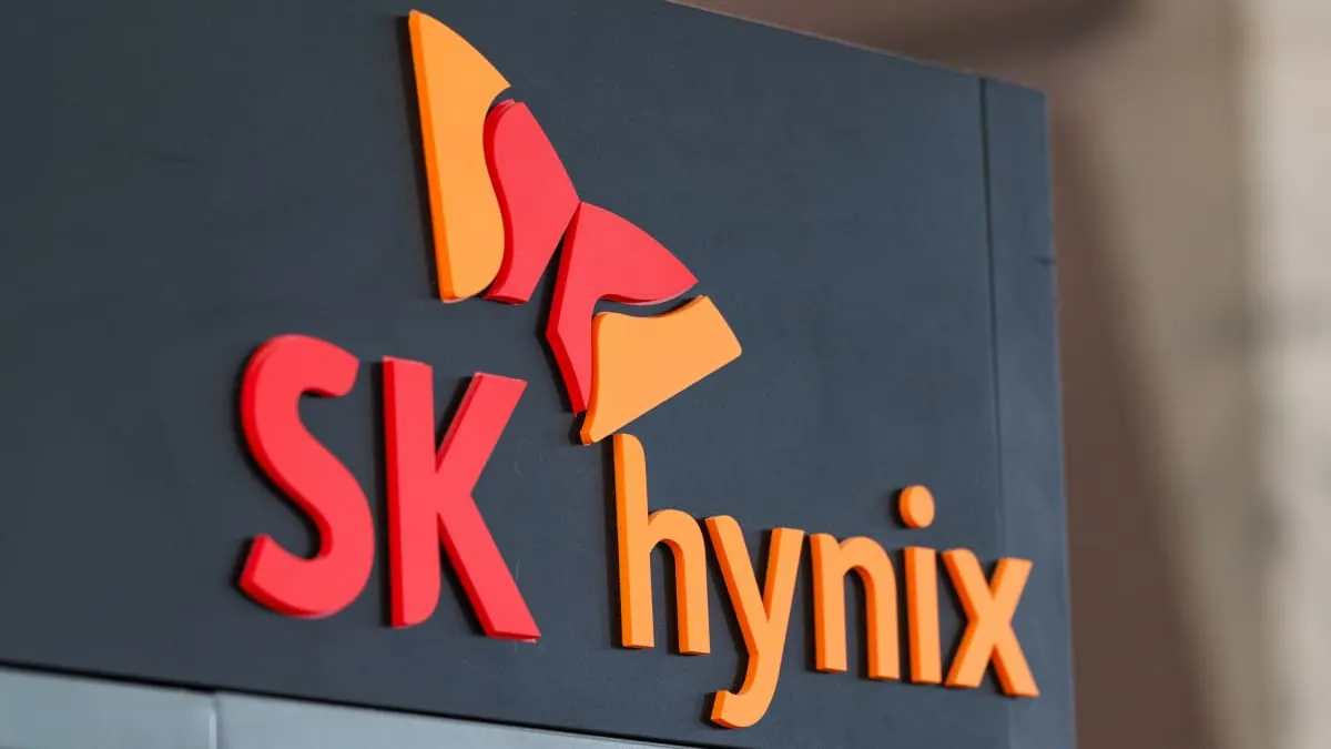 SK Hynix logo in red and orange on a dark grey wall sign
