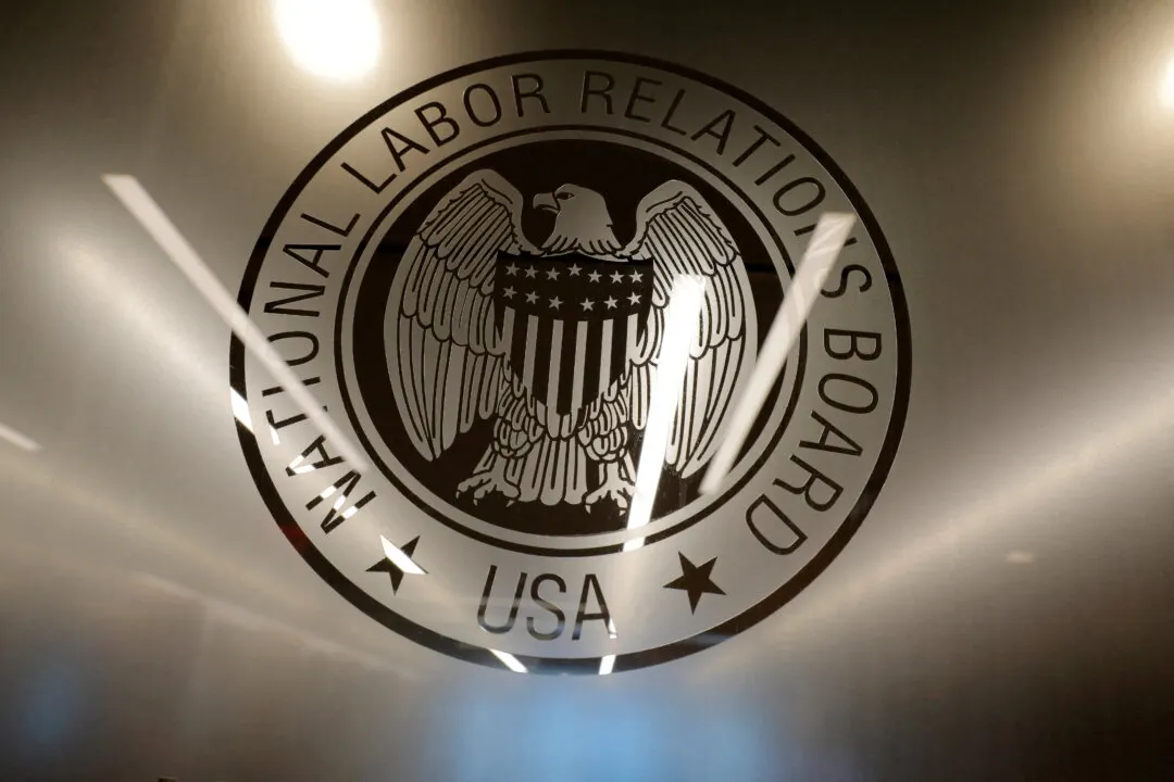 National Labor Relations Board seal with eagle and shield on a glossy reflective surface.