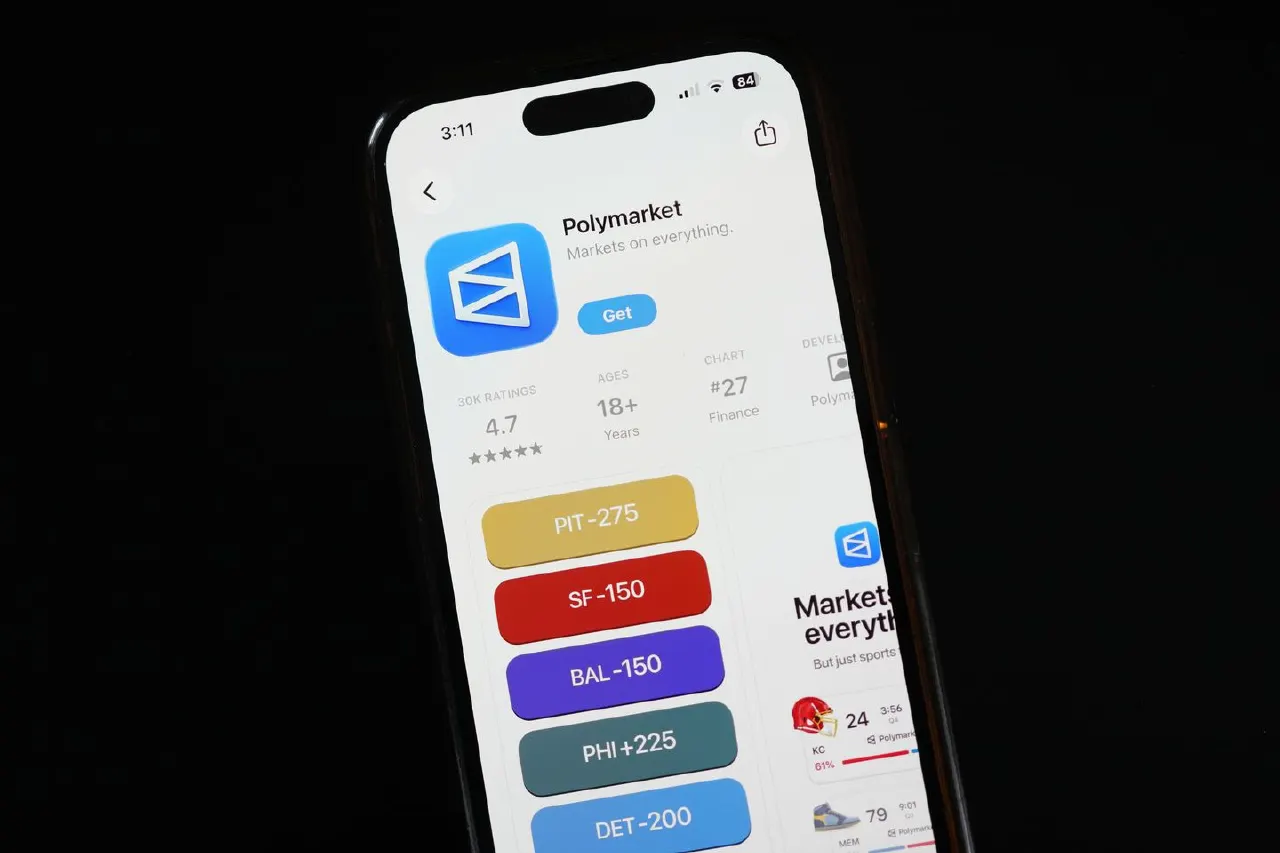 Phone screen showing Polymarket app store page with its logo and sports betting odds.
