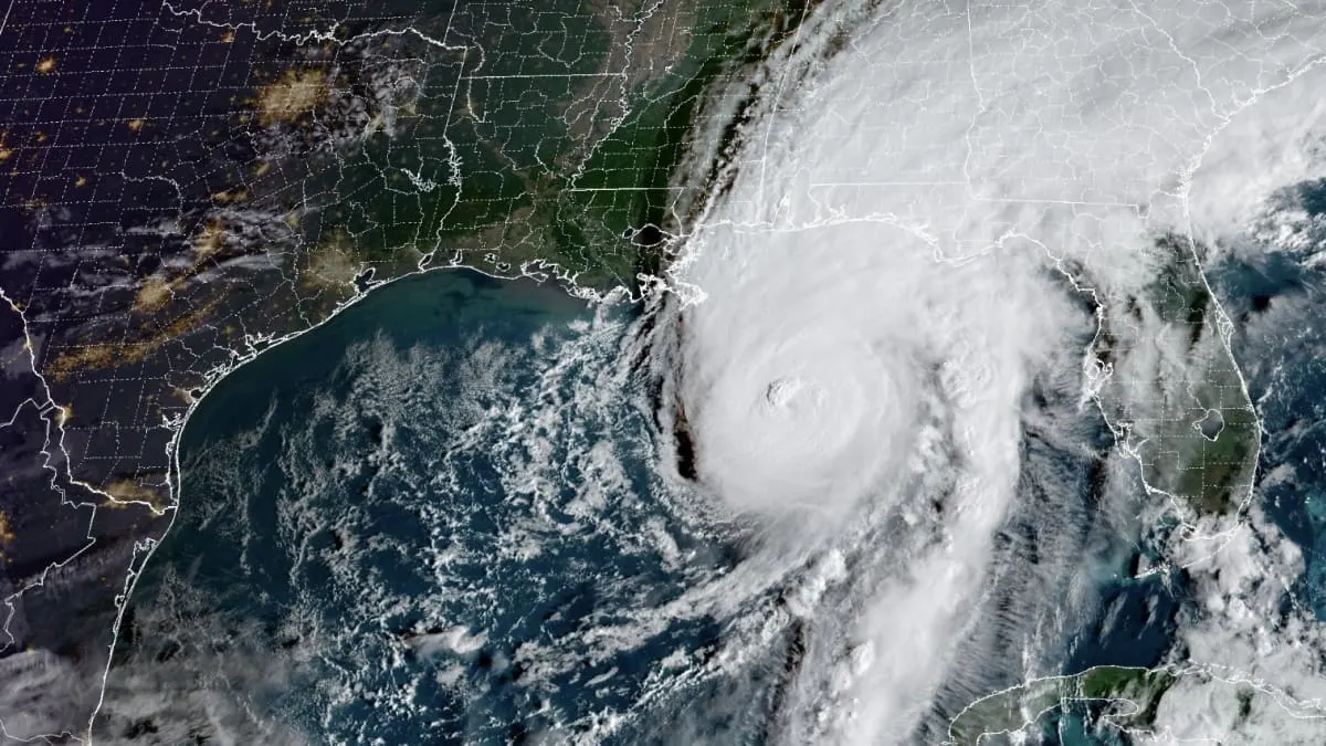 Satellite view of a large hurricane with a clear eye over the Gulf of Mexico near Florida.