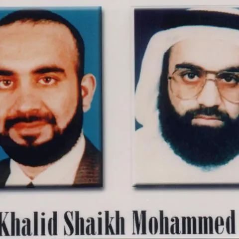 Two side-by-side portrait photos of bearded men with a printed name caption beneath
