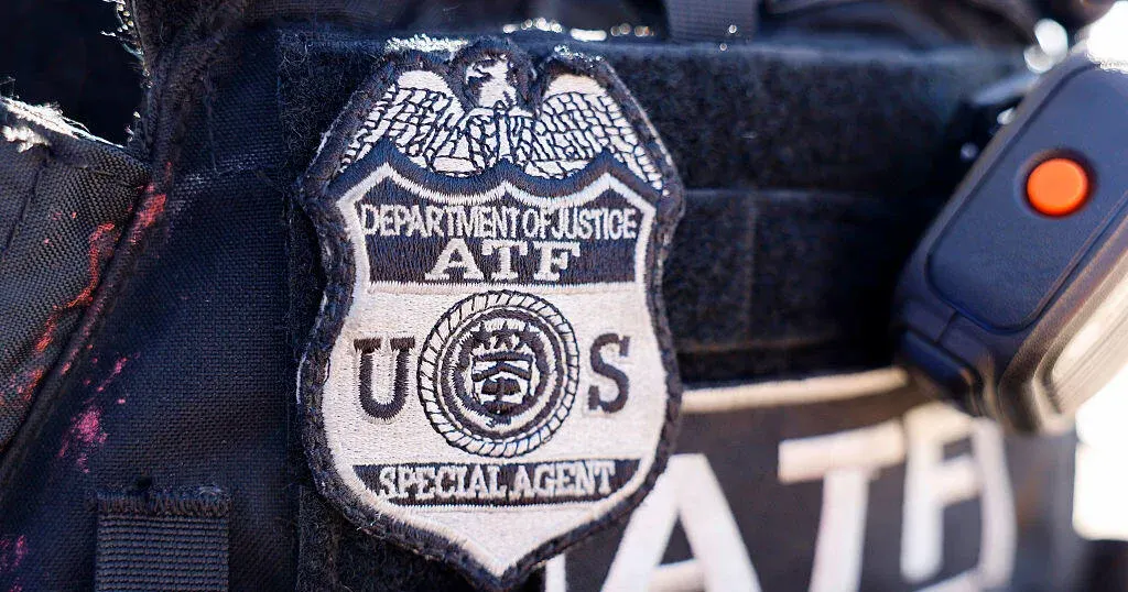 Close-up of a Department of Justice ATF special agent shoulder patch on tactical vest.