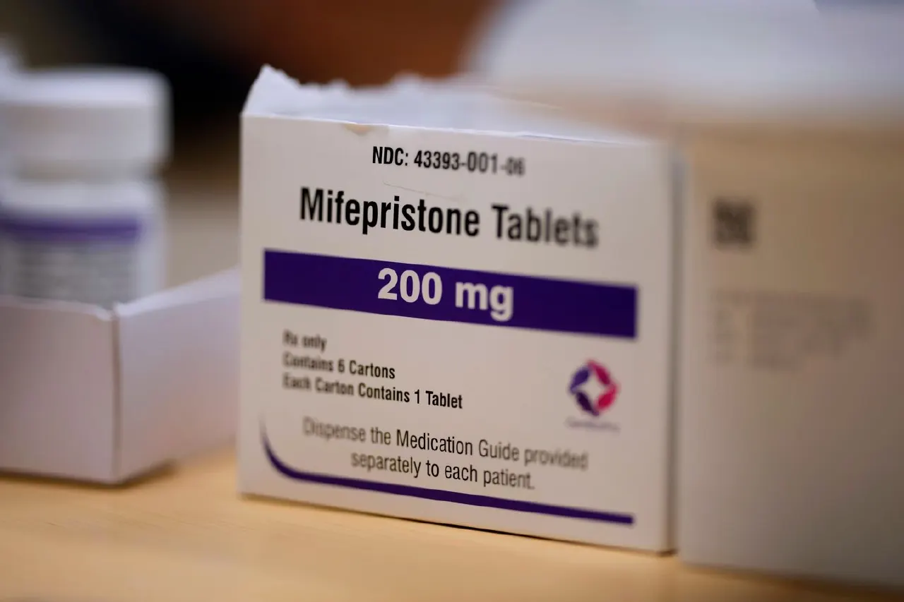 Cardboard box of Mifepristone 200 mg tablets on a table, shallow depth of field.