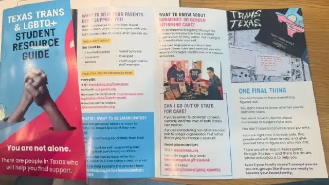 Open Texas Trans and LGBTQ+ student resource guide pamphlets on a table, showing photos and text.