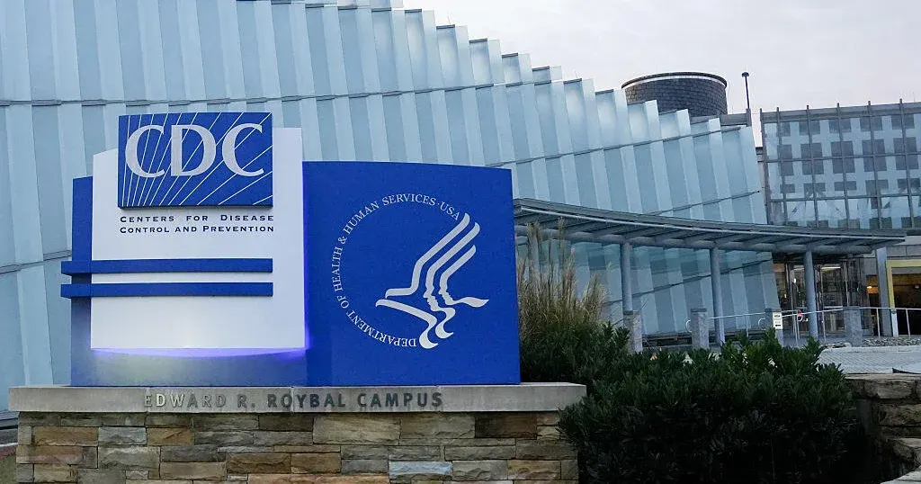 CDC sign and Health and Human Services seal at Edward R. Roybal Campus building entrance