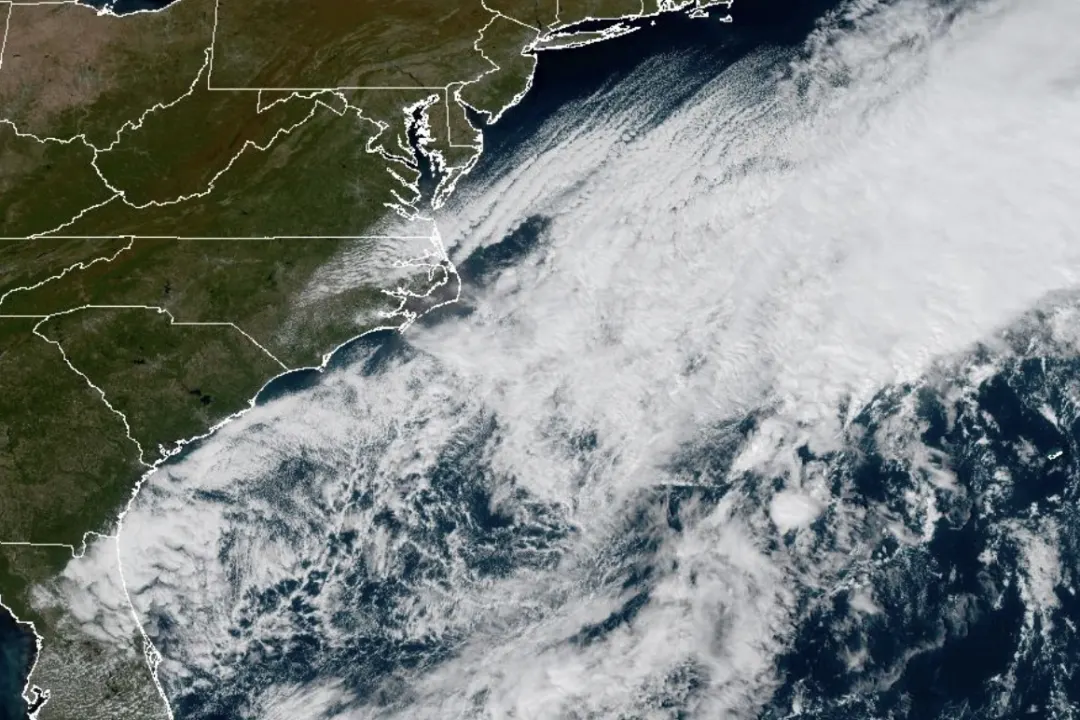 Satellite view of storm clouds spreading over the Carolina coast and Atlantic Ocean.