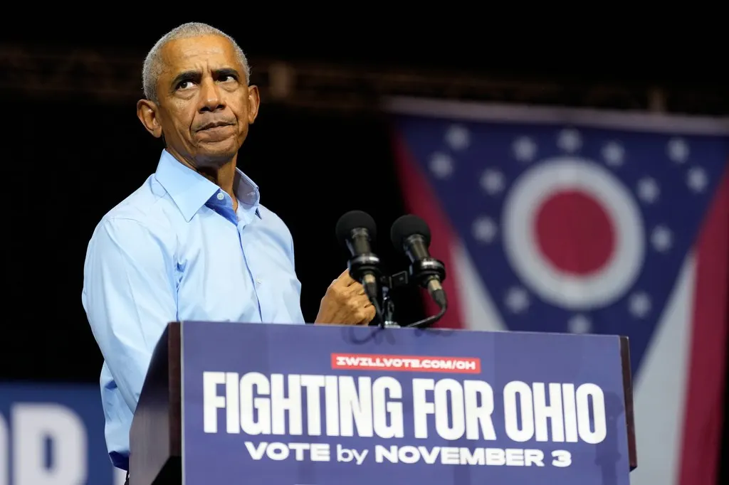 Man in blue shirt speaks at podium reading Fighting for Ohio, Ohio flag behind.
