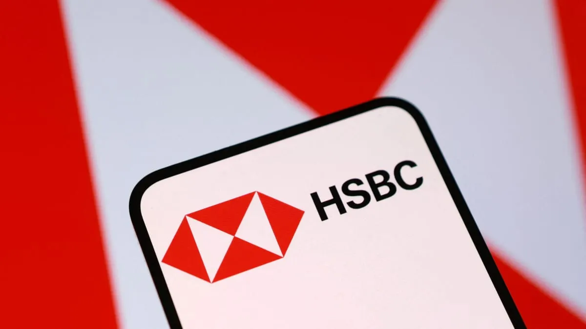 Smartphone screen showing HSBC logo against red and white background