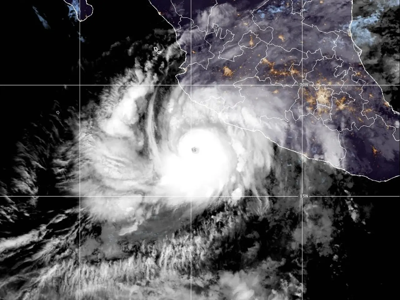 Satellite infrared view of a hurricane with eye approaching Mexico's Pacific coast at night.