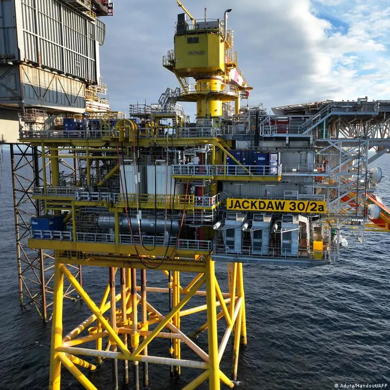 Yellow offshore gas platform labelled Jackdaw 30/2a in the North Sea, aerial view.