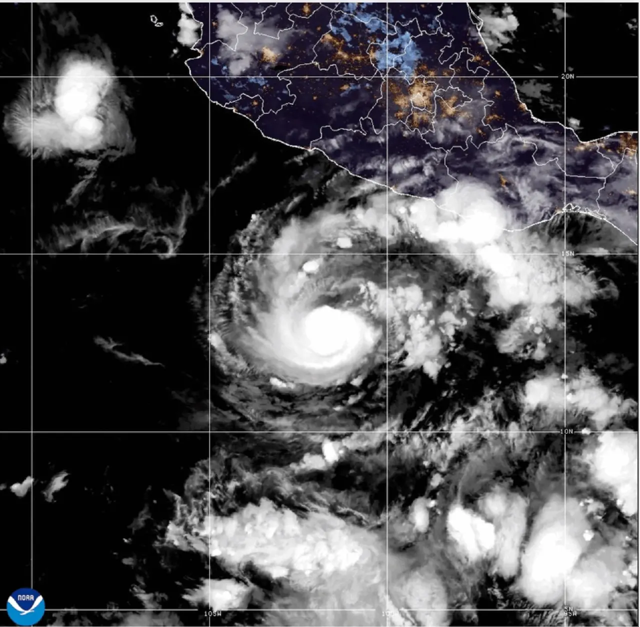 Satellite image of a hurricane's eye over the Pacific near Mexico's coastline, with NOAA logo.