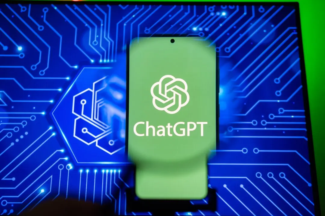 Smartphone showing ChatGPT logo in front of glowing blue circuit board graphic